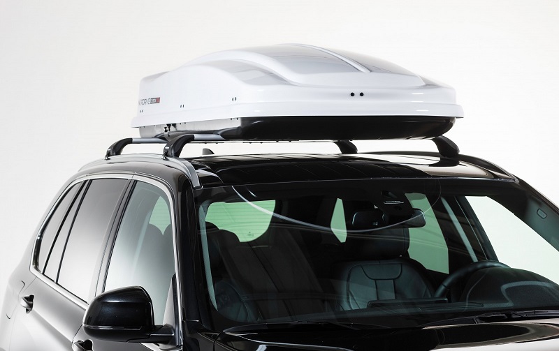 Car roof boxes on top of a car